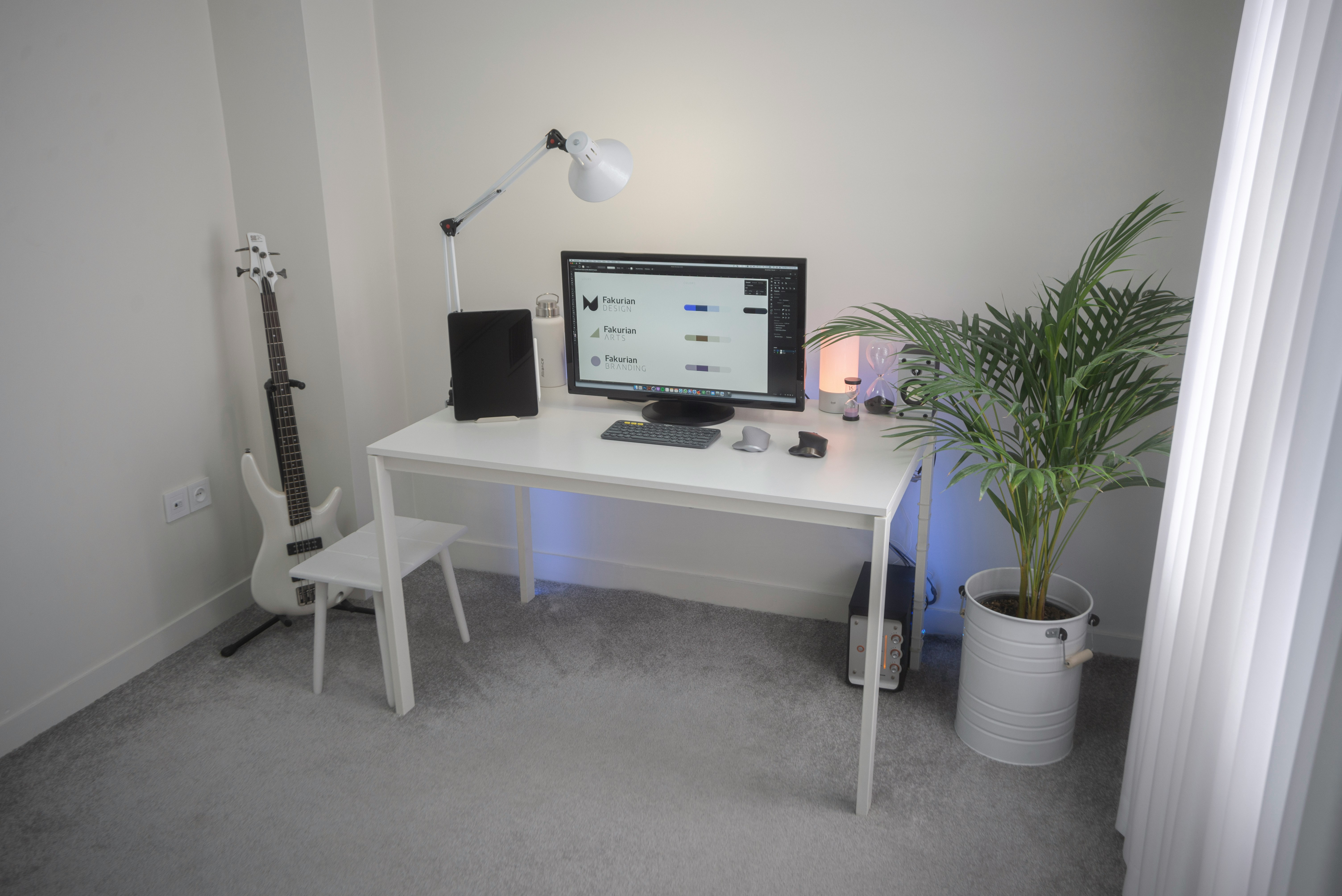 black flat screen computer monitor on white wooden desk